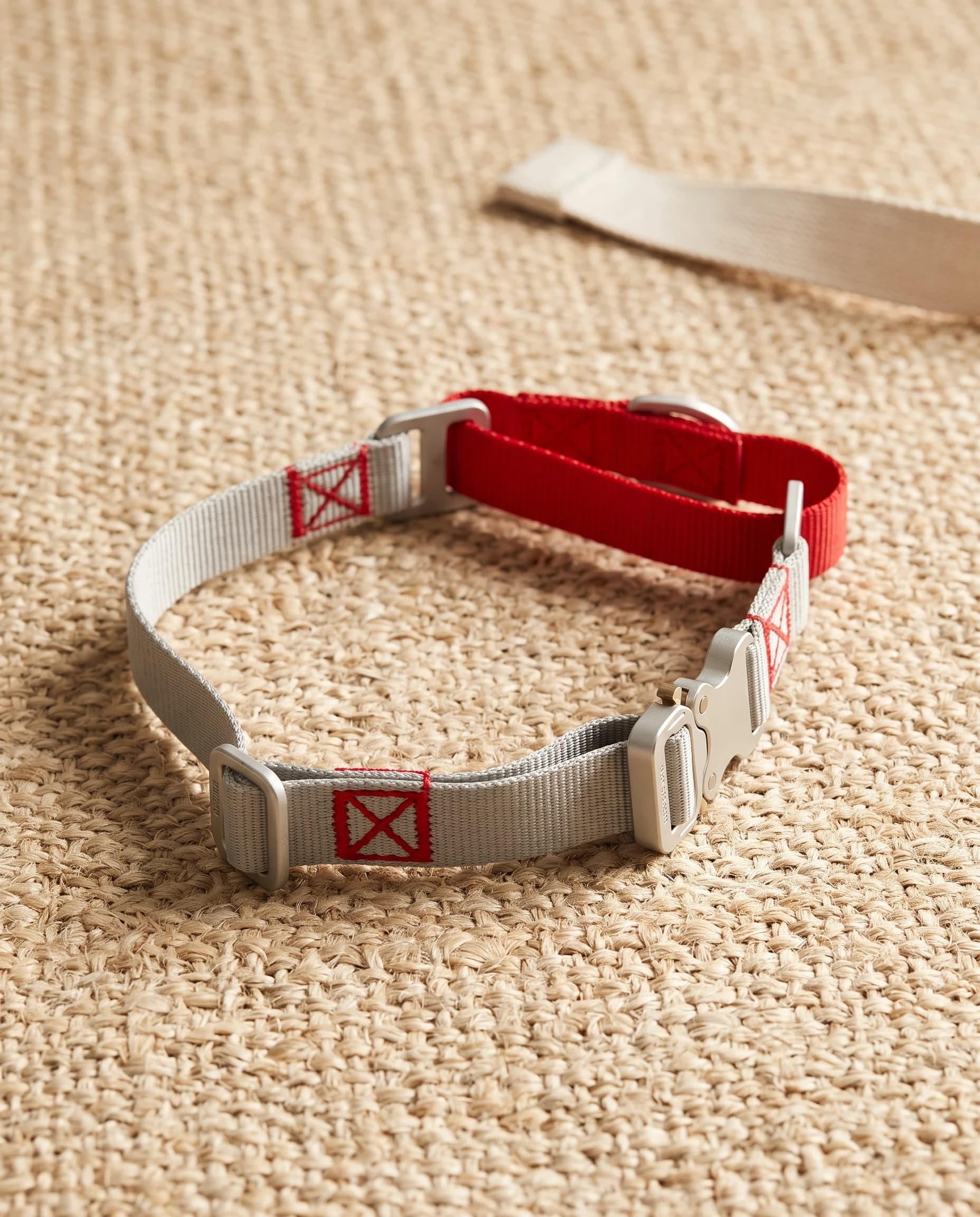 The red Field Collar from a low angle, the stitched red mark and the D-ring