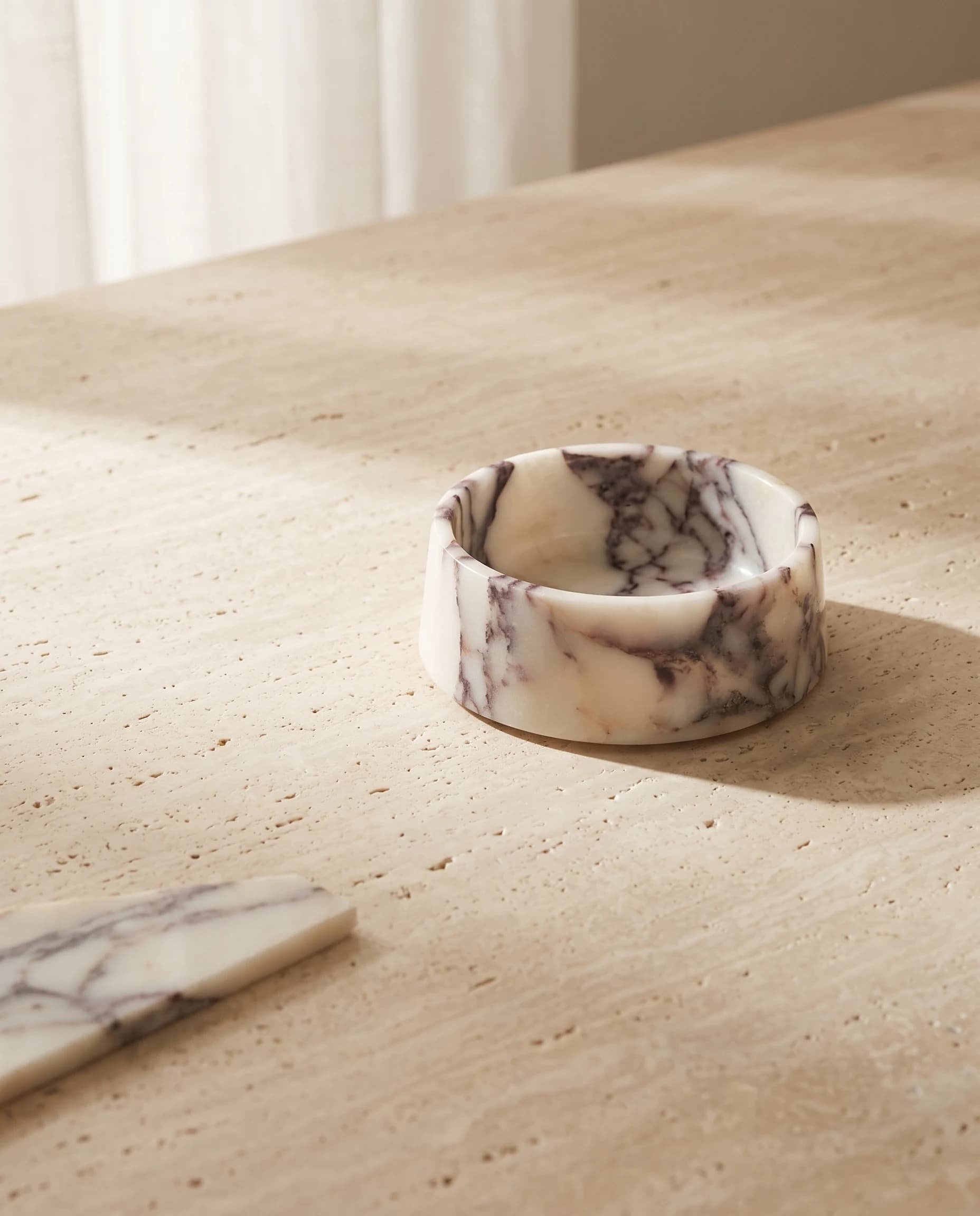 The Calacatta Viola bowl from table height, showing the depth of its wall